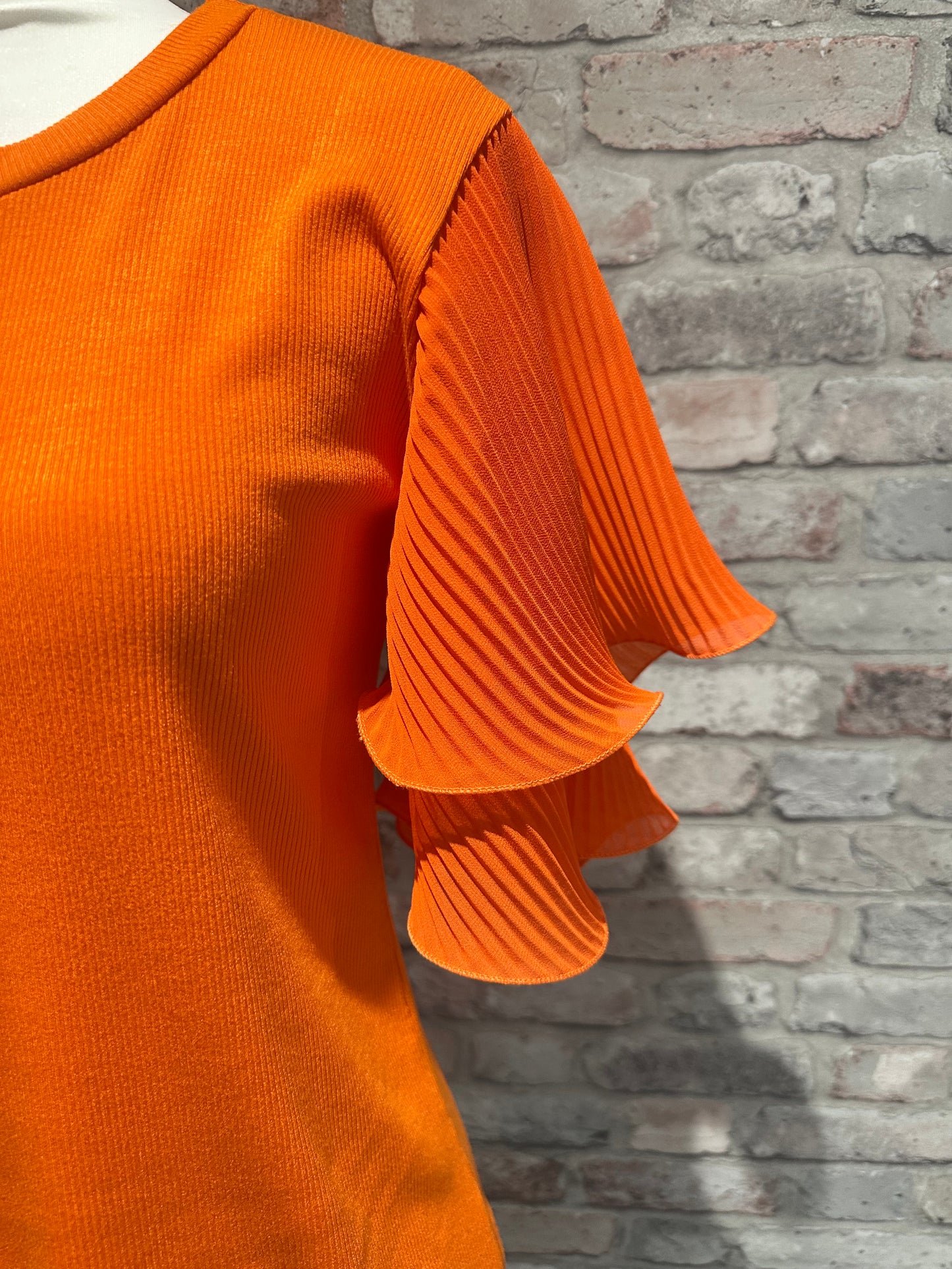 Orange frill sleeve top